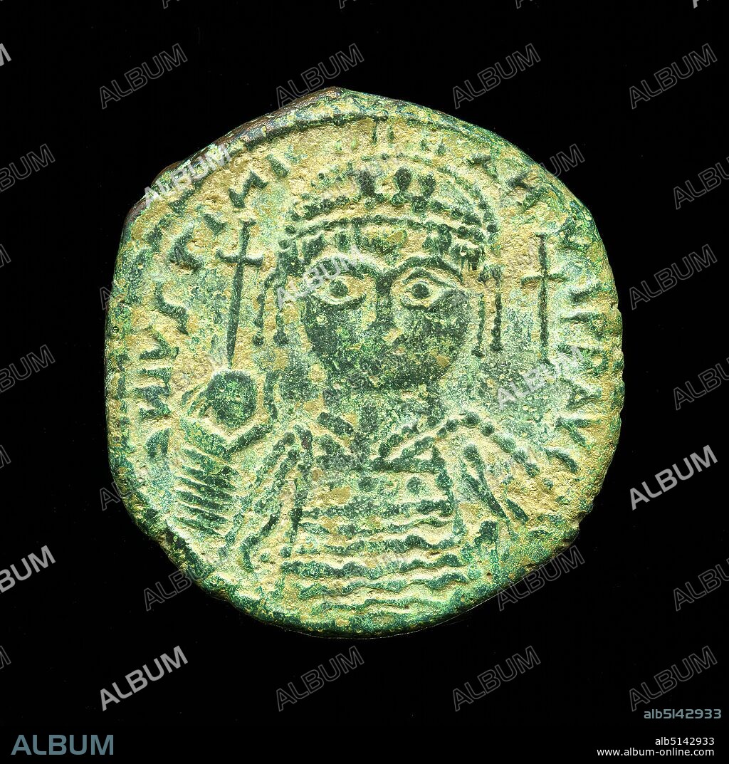 Follis Iustinian I, g bronze, total: diameter: 3 cm, inscription: Obverse: next to the head on the right a cross, circumferential inscription DN IVSTINIANVS PP AUC, coins, numismatics, portrait, portrait of ruler, state portrait, historical person, emperor, late antiquity, Originally the follis was introduced by the Roman emperor Diocletian in his coinage reform around 294 AD. Coined from bronze, the coins were covered with a thin silver film. Since the currency reform of the emperor Anastastius around 498 B.C. they have been large bronze coins. On the value side of the folly, the large letters MY in ligature. In Greek numerals they stand for the value 40. Due to its size, this folly belongs to the group of 'Large Module Folles'. It shows an armored bust of the emperor Iustinian I. with crown and jewelry on the front side (obverse). In his right hand he holds the globe with cross. Next to the head there is a cross on the right. The circumferential inscription facing inwards is DN IVSTINIANVS PP AUC (Dominus noster Iustinianus perpetuus Augustus - Our Lord Iustinian, eternal ruler). The reverse side (lapel) is dominated by the MY stamp, under which a small B can be seen. On the left is the inscription ANNO (in the year), on the right XXIII (23); this is a reference to the minting date in the 23rd year of the emperor's reign 560/1 A.D. In the lower section there is a reference to the mint KYZ(ikos). Iustinian I. - with full name Flavius Petrus Sabbatius Iustinianus - was born around 482 AD in Tauresium and ruled the Imperium Romanum from August 1, 527 AD until his death on November 14, 565 AD. He is considered one of the most important rulers of late antiquity. His reign marked the transition from the ancient Imperium Romanum to the Byzantine Empire. He succeeded in reconquering large parts of the Western Roman Empire, which had been lost to the Ostrogoths and Vandals in 476 AD. At the same time he closed the Neo-Platonic School of Philosophy in Athens in 529 and abol.
