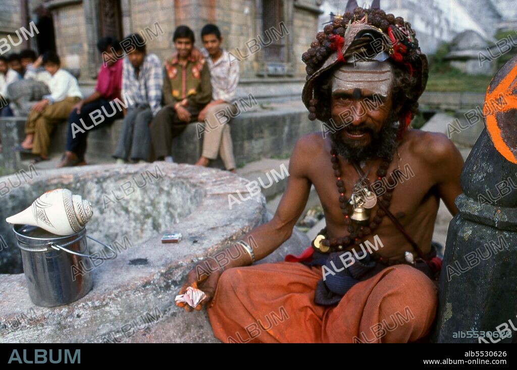 They are known, variously, as sadhus (saints, or 'good ones'), yogis (ascetic practitioners), fakirs (ascetic seeker after the Truth) and sannyasins (wandering mendicants and ascetics). They are the ascetic – and often eccentric – practitioners of an austere form of Hinduism. Sworn to cast off earthly desires, some choose to live as anchorites in the wilderness. Others are of a less retiring disposition, especially in the towns and temples of Nepal's Kathmandu Valley. If the Vale of Kathmandu seems to boast more than its share of sadhus and yogis, this is because of the number and importance of Hindu temples in the region. The most important temple of Vishnu in the valley is Changunarayan, and here the visitor will find many Vaishnavite ascetics. Likewise, the most important temple for followers of Shiva is the temple at Pashupatinath. Vishnu, also known as Narayan, can be identified by his four arms holding a sanka (sea shell), a chakra (round weapon), a gada (stick-like weapon) and a padma (lotus flower). The best-known incarnation of Vishnu is Krishna, and his animal is the mythical Garuda. Shiva is often represented by the lingam, or phallus, as a symbol of his creative side. His animal is the bull, Nandi, and his weapon is the trisul, or trident. According to Hindu mythology Shiva is supposed to live in the Himalayas and wears a garland of snakes. He is also said to smoke a lot of bhang, or hashish.