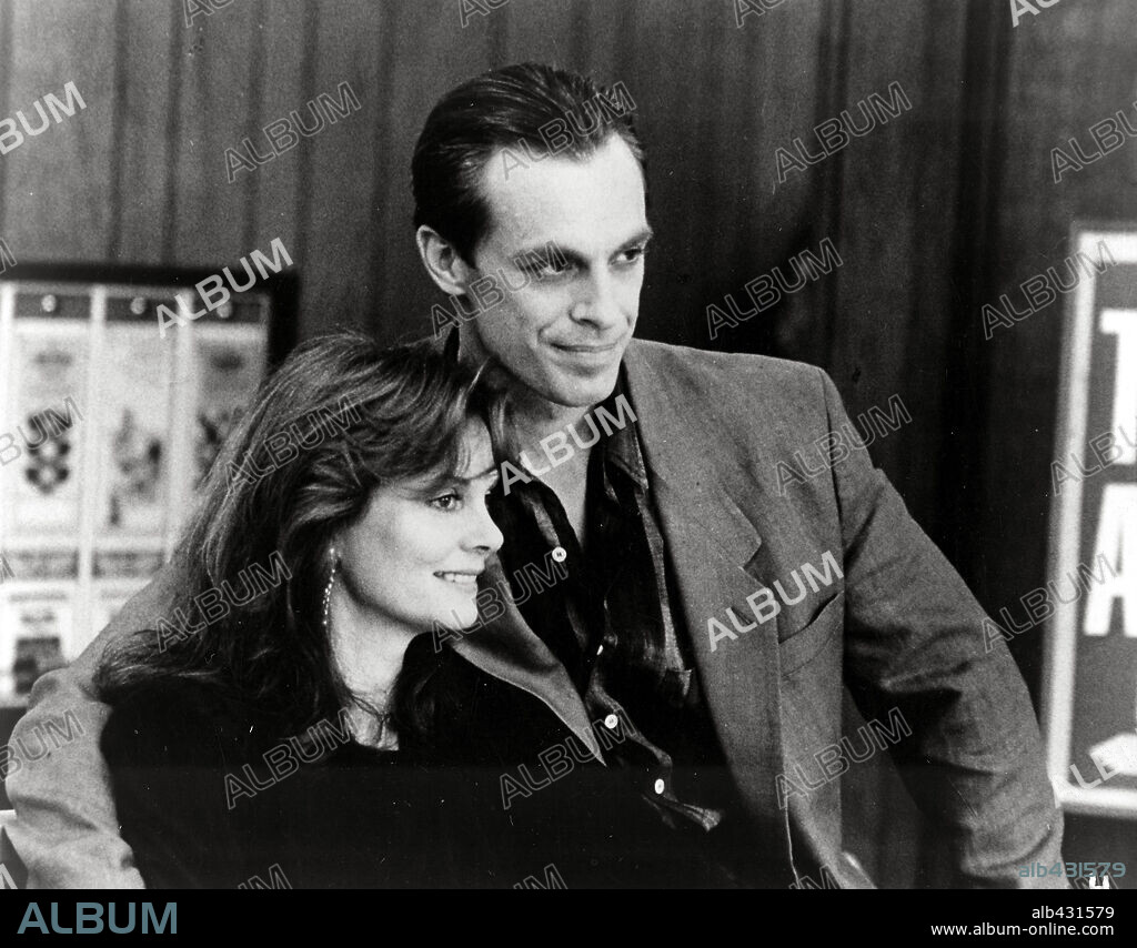 KEITH CARRADINE and LESLEY ANN WARREN in CHOOSE ME, 1984, directed by ALAN RUDOLPH. Copyright ISLAND ALIVE/TARTAN.