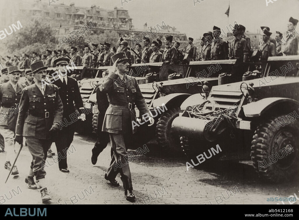 The Liberation of Paris, August 26, 1944, General de Gaulle and Marshal Leclerc. Charles André Joseph Marie de Gaulle (November  22, 1890 - November  9,1970) was a French army officer and statesman who led the Free French Forces against Nazi Germany in WWII, and chaired the Provisional Government of the French Republic from 1944-46. In 1958, he came out of retirement as President of the Council of Ministers. He rewrote the Constitution of France and founded the Fifth Republic after approval by referendum. He was elected President of France later that year, a position to which he was reelected in 1965 and held until his resignation in 1969. No photographer credited, 1944 (cropped and cleaned).