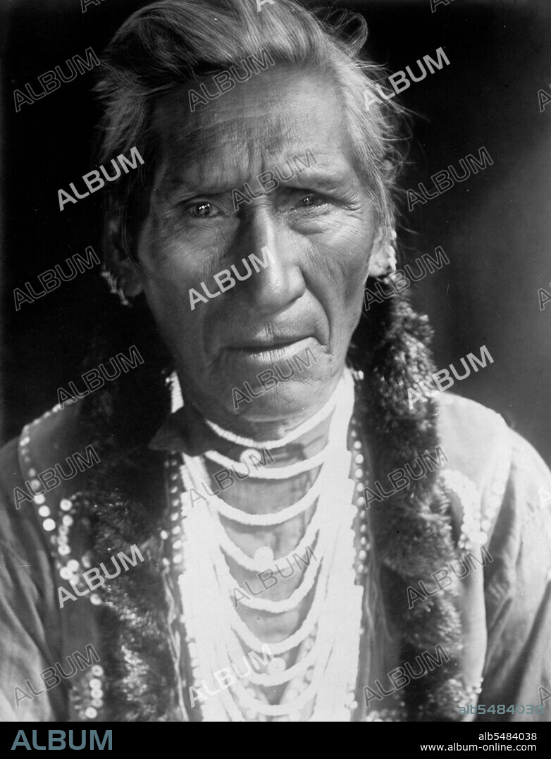 Edward S. Curits Native American Indians - Photograph shows Flathead man, head-and-shoulders portrait, facing front circa 1910.