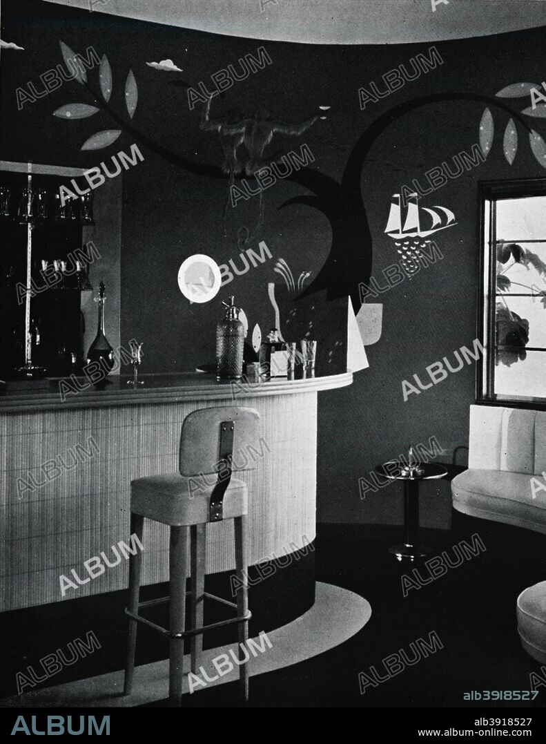 'The Bar in Mr. and Mrs. Joe Penner's house, Beverly Hills, California', c1939. A room in American comedian Joe Penner's house (1904-1941). Designed by Paul T. Frankl (1886-1958), mural by Nicolai Remisoff (1887-1975). From The Studio Volume 117. [The Offices of the Studio, London, New York, 1939.].