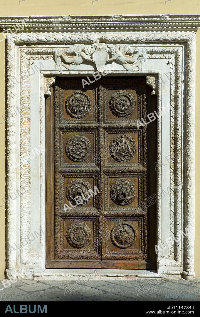 Ancient traditional doorway of Curia Arcivescoville in Piazalle Mons Giulio Arrigoni, in Lucca, Italy.