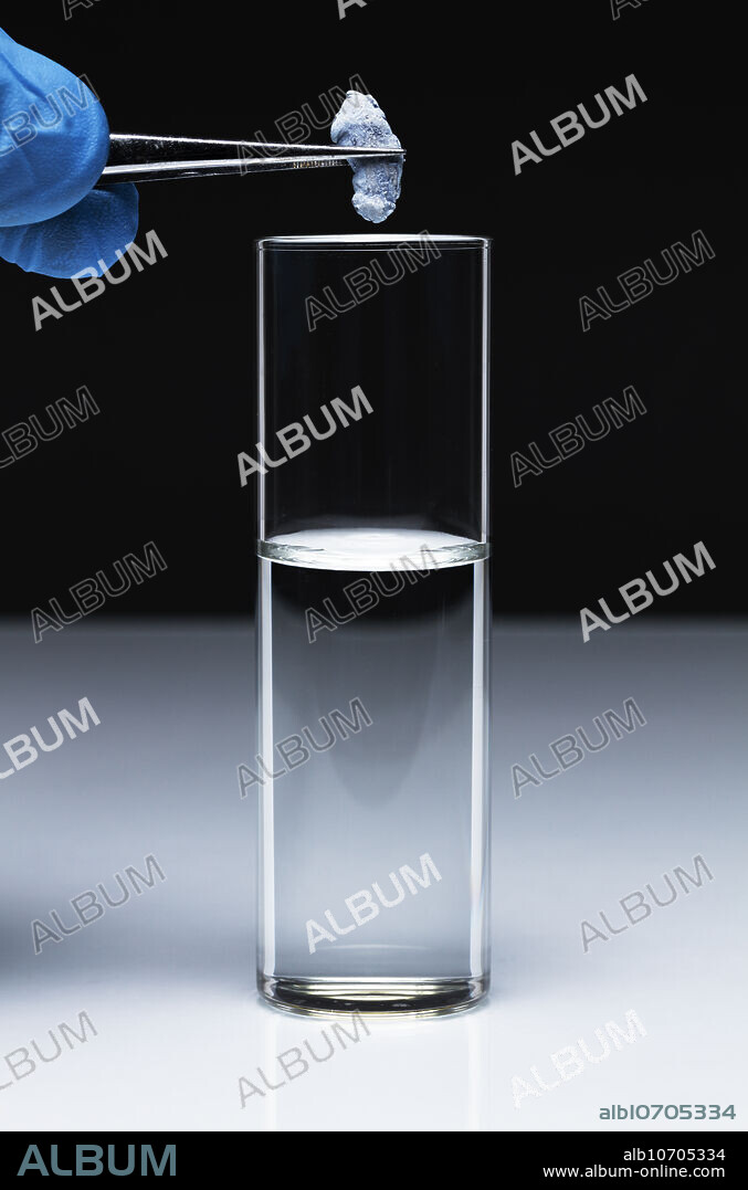 Potassium reacts with water, 1 of 1. A small piece of potassium metal (K) is dropped into a vial with water (H2O). Potassium reacts exothermically with water to produce potassium hydroxide (KOH) and hydrogen gas (H2): K + H2O -> KOH + H2. Due to released heat, potassium melts and burns, producing a mixture of potassium peroxide (K2O2) and potassium superoxide (KO2): K + O2 -> K2O2 and K + O2 -> KO2. Ultimately potassium explodes.