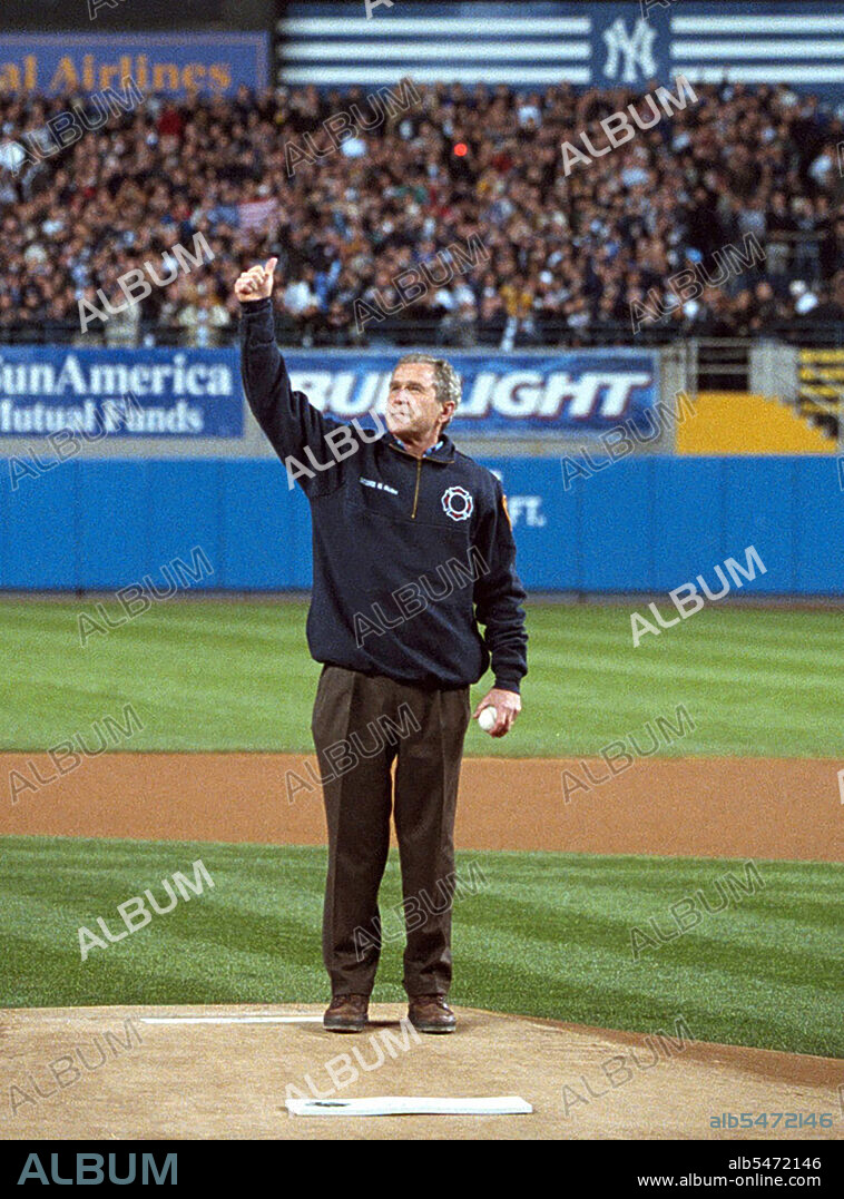 President George W. Bush gives a thumbs-up as he stands on the mound at Yankee Stadium Tuesday, Oct. 30, 2001..