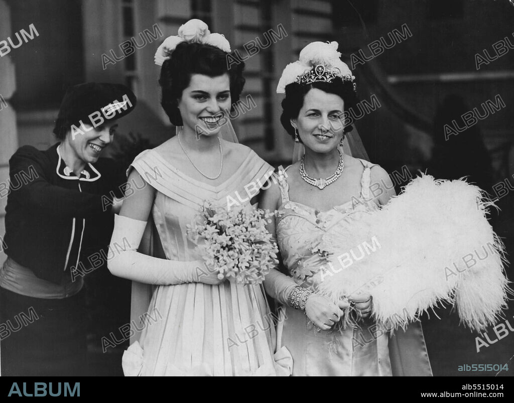 American Ambassador's Daughter Presented At Court -- Eunice Kennedy and her mother as they left the Embassy in Princess Gate, Kensington, for the Palace. Eunice is wearing a gown of very tulle and satin crinoline with off-the-shoulder neckline and tight-fitting bodice, train to match and diamond ornaments. Eunice, one of the nine children of the American Ambassador in London, was presented by her mother, Mrs. Joseph Kennedy, at one of the last Courts of the season at Buckingham Palace, London. July 12, 1939.