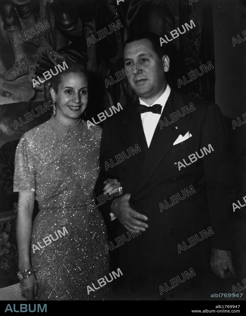 Juan Peron arm in arm with wife Evita. Evita smiling arm in arm with husband Juan Peron, the President of the Argentinian Republic. Argentina 1951.