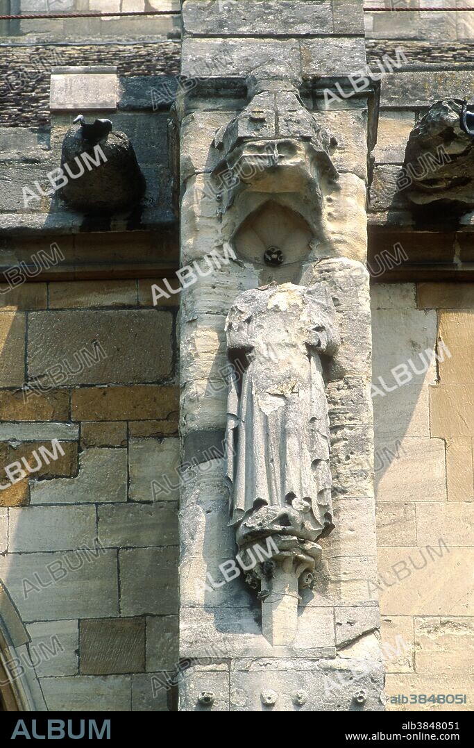 Weathered stone sculpture damaged by acid rain, Gloucester Cathedral, United Kingdom.