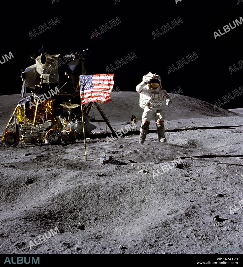 CHARLES DUKE. John Young on the lunar surface, 1972. Astronaut John W. Young, commander of the Apollo 16 lunar landing mission, jumps up from the lunar surface as he salutes the U.S. Flag at the Descartes landing site during the first Apollo 16 extravehicular activity (EVA-1). Astronaut Charles M. Duke Jr., lunar module pilot, took this picture. The Lunar Module (LM) "Orion" is on the left. The Lunar Roving Vehicle is parked beside the LM. The object behind Young in the shade of the LM is the Far Ultraviolet Camera/Spectrograph. Stone Mountain dominates the background in this lunar scene.