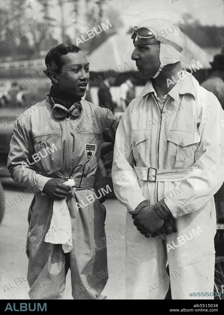 Prince Wins Big Race At Brooklands - "B. Bira" (Prince Chula) chatting to C.S. Staniland before the race.  "Mr. B. Bira" (prince Chula of Siam) won the big race for the Campbell Trophy at Brooklands today. May 01, 1937. (Photo by LNA).