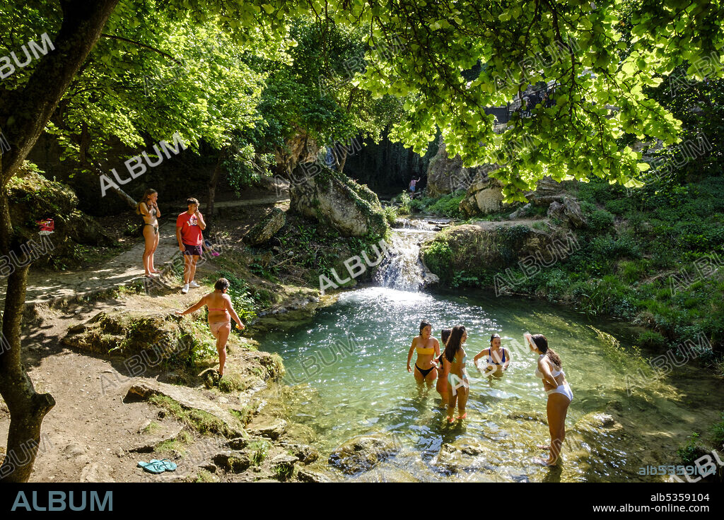 group of bathers cooling off, Molinar river, Tobera, town of the Burgos municipality of Frías, Autonomous Community of Castilla y León, Spain.