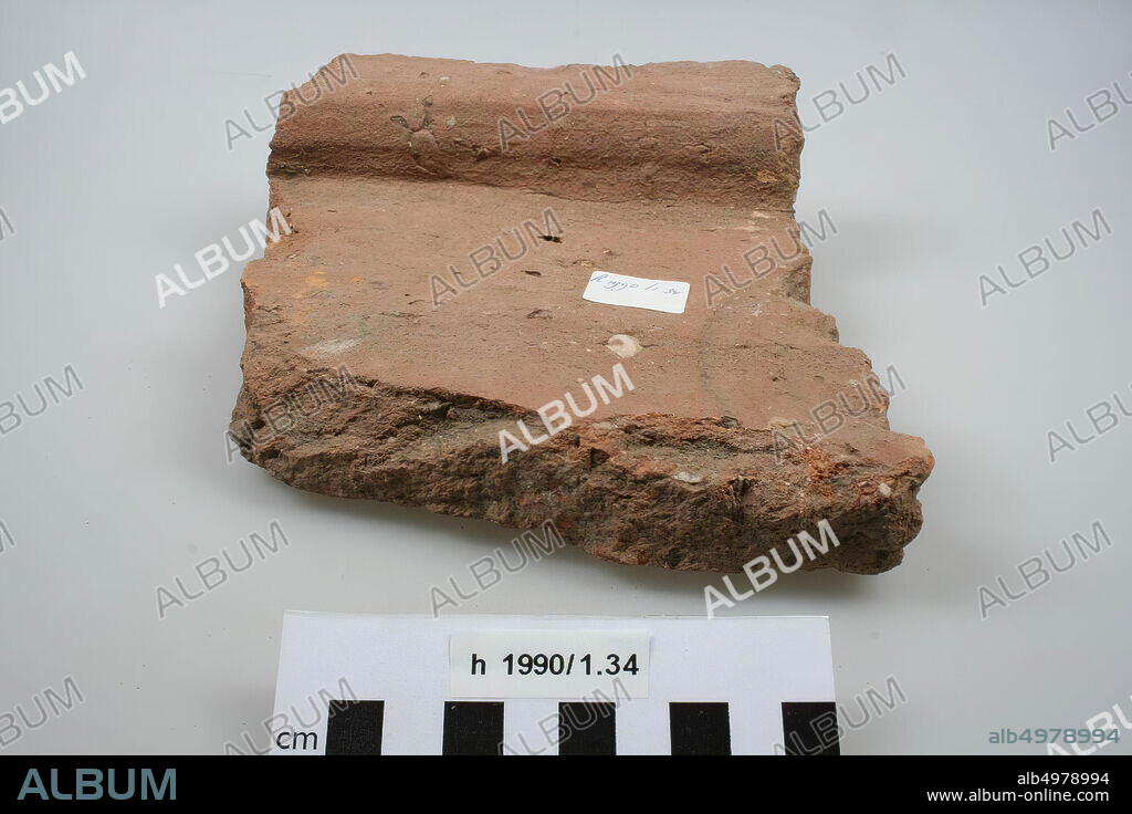 Fragment of a tegula (roof tile) with round stamp, roof tile (tile), fragment, earthenware, brick, 18.6 x 16.5 x 6.4 cm, roman, Netherlands, South Holland, Leiden, Leiden, Roomburg.