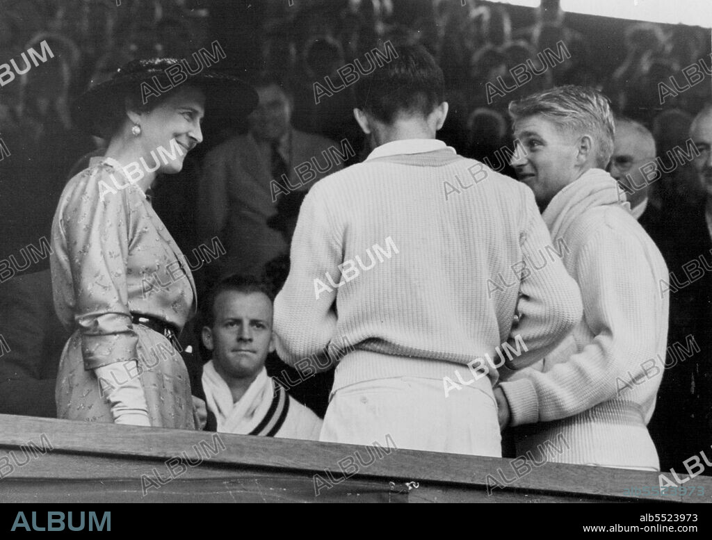 Hoad and Reosewall win Doubles - The Duchess of Kent presenting the trophy to Len Hoad (right) and Ken Rosewall after they has beaten Mervyn Rose and R. Hartwig in the all-Australian final of the men's doubles at the Wimbledon Lawn Tennis Championship.Hoad and Rosewall won 6-4, 7-5, 4-6, 7-5. July 04, 1953. (Photo by United Press Photo).