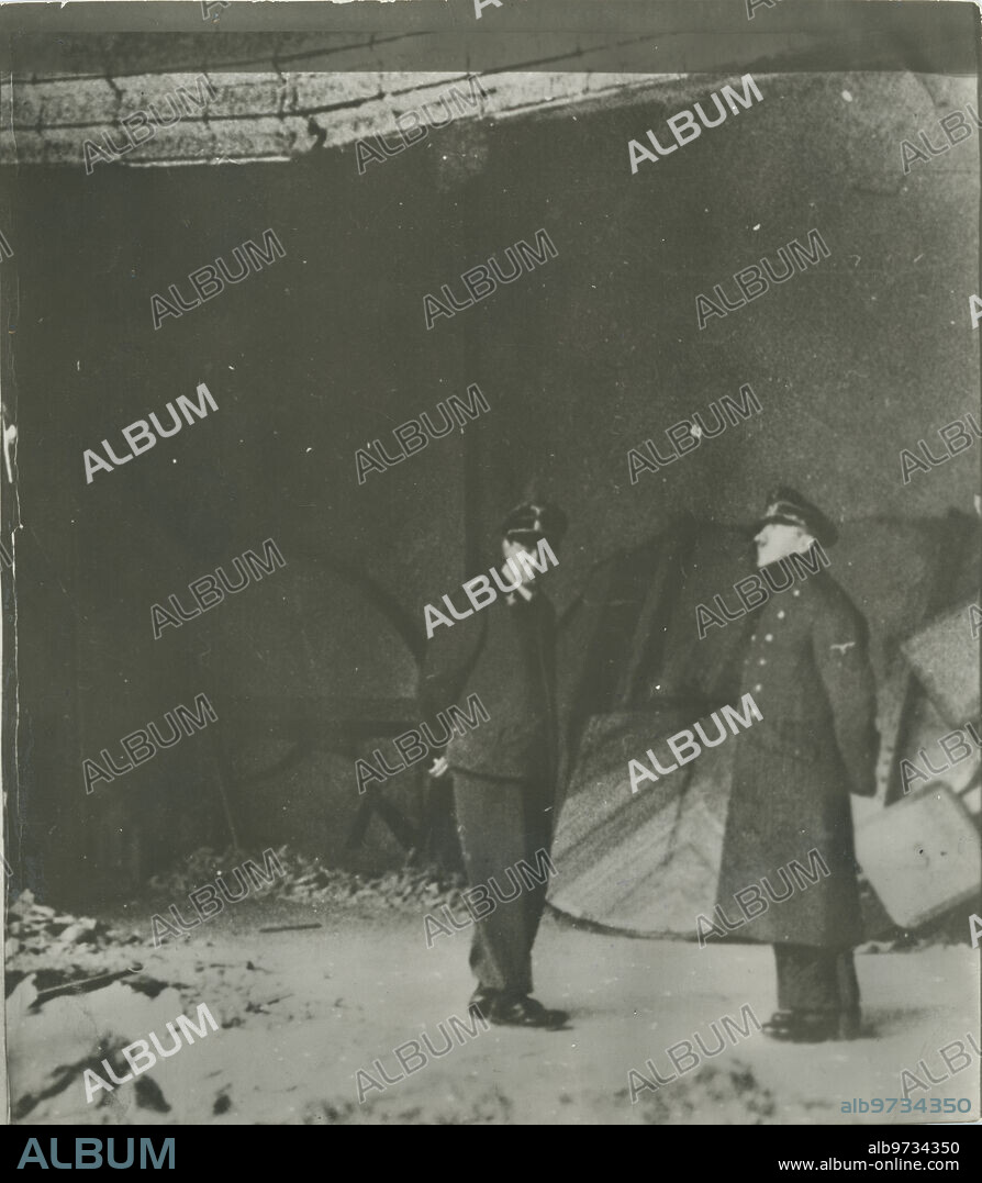 Berlin (Germany), 04/20/1945. Adolf Hitler and his aide-de-camp Julius Schaub contemplate the ruins of the Reich Chancellery.