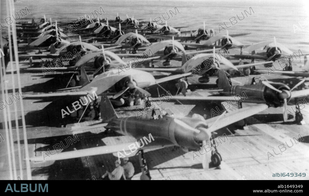 Aircraft are prepared for a morning sortie on the Imperial Japanese Navy aircraft carrier Zuikaku, east of the Solomon Islands, on May 5, 1942. On May 7 and 8 the carrier was involved in exchanges of airstrikes with United States Navy carriers during the Battle of the Coral Sea.