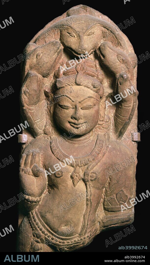 Depiction of Naga, a snake divinity, overshadowed by the heads of a five-headed serpent, made form sandstone. The right hand holds a rosary and bestows protection. from the V&A's collection, 10th century.