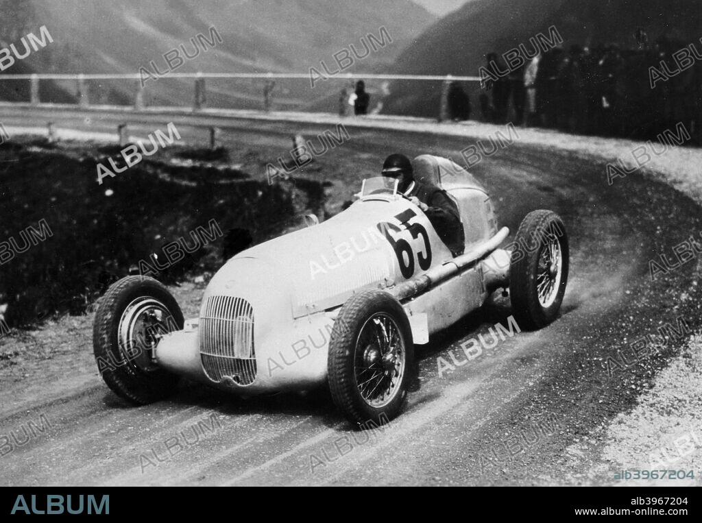 Rudolf Caracciola driving Mercedes-Benz W25 Grand Prix car, c1934-c1935. Caracciola was the highly successful Mercedes team's top driver in the 1920s and 1930s. He won numerous races for them, and was European Champion three times, in 1935, 1937 and 1938. He also was Mercedes' driver in Land Speed Record attempts, again being highly successful.