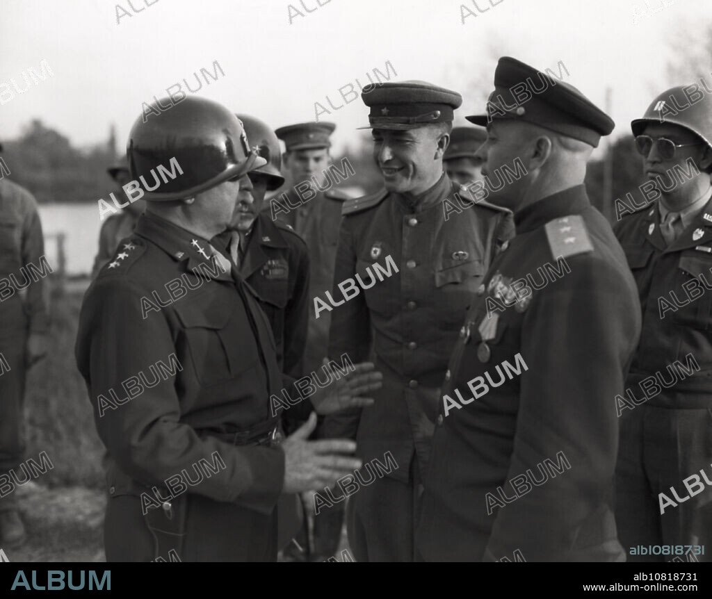 Enns, Austria, May 9, 1945 Lt. Gen. Walton H. Walker CG of the XXth Corps, U.S. Third Army, and his staff, meet up with Lt-General Birukoff, CG, XXth Carde Corps, 4th Russian Army, and his staff, at the Enns River.