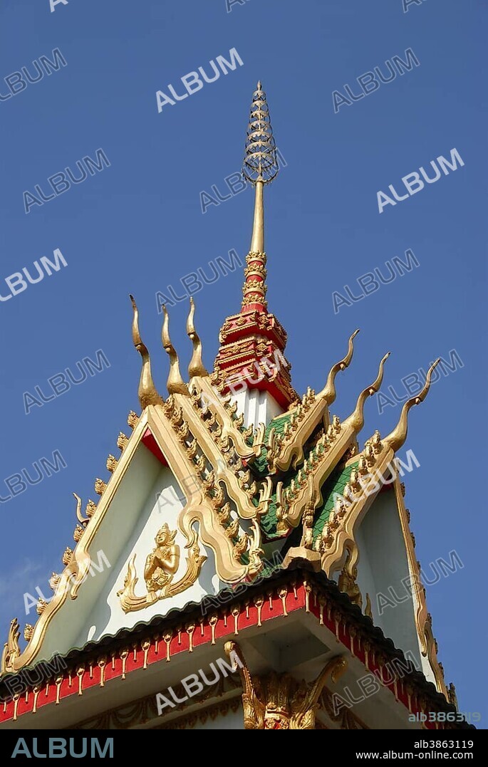 Gable with tower and spire, modern Buddhist Temple Wat Nakoun Noi, Vientiane province, Laos, South East Asia, Asia.