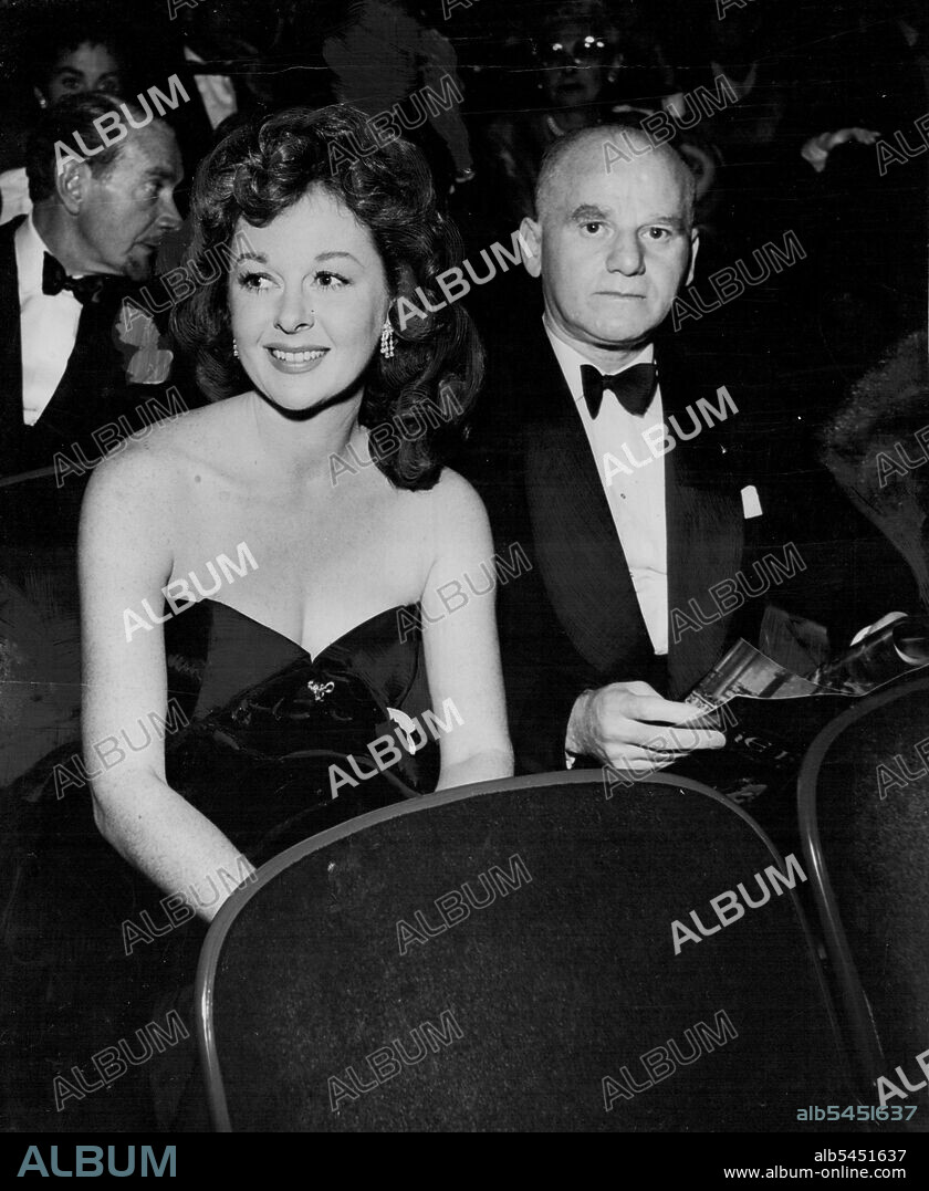 Susan Hayward made her first public appearance since her break with husband, Jess Barker, at a premiere with 20th Century-Fox executive, Lew Schreiber. The bearded gentleman is Clifton Webb. November 30, 1953.