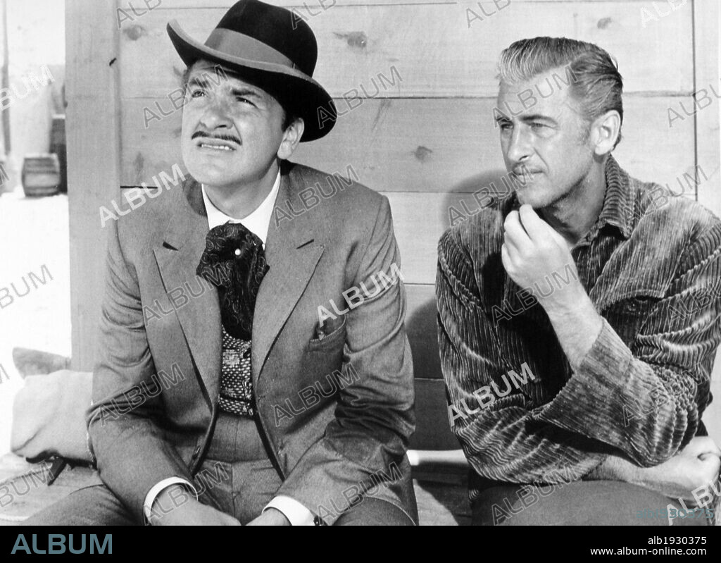 ERNIE KOVACS and STEWART GRANGER in NORTH TO ALASKA, 1960, directed by HENRY HATHAWAY. Copyright 20TH CENTURY FOX.