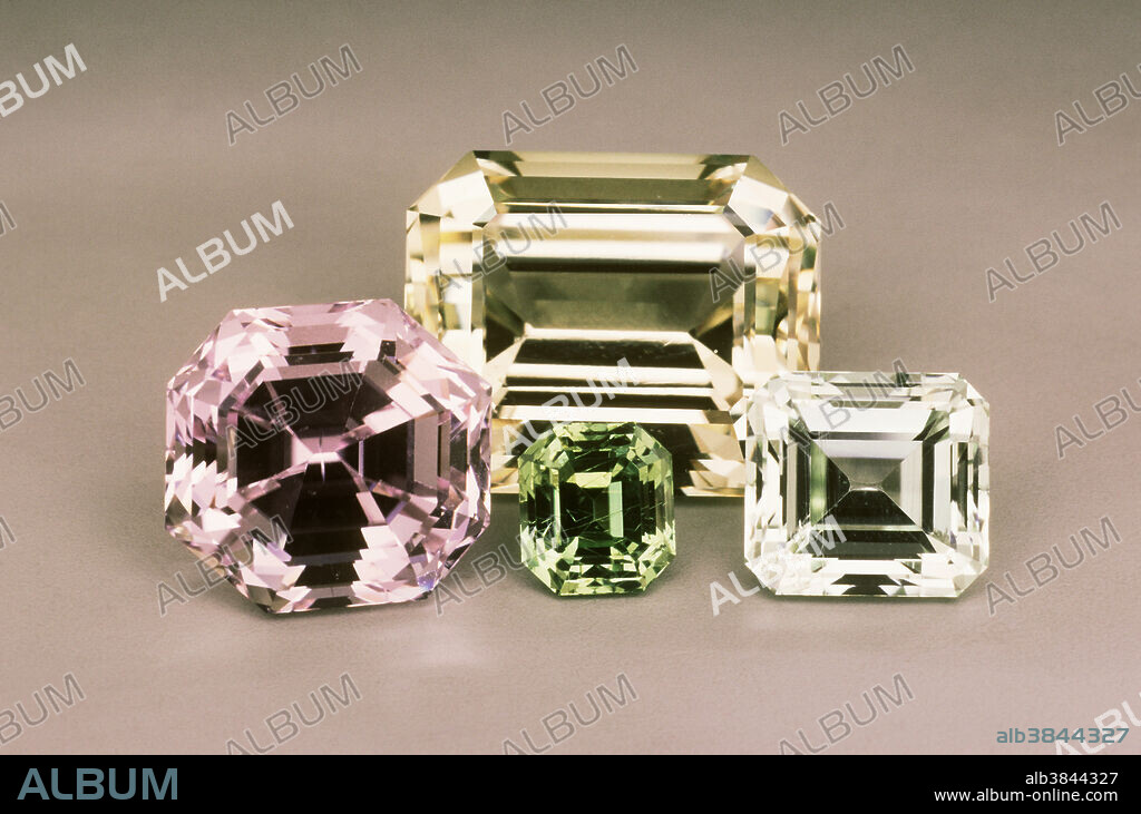 Spodumene, a lithium silicate mineral, occurs in crystals (sometimes very large) of varying colors. The main localities for this gem are Brazil and Afghanistan. The most familiar color is the pink variety known as kunzite, but green and yellow stones have also found their way into the marketplace. These gems range from 1.7 to 19.3 carats.