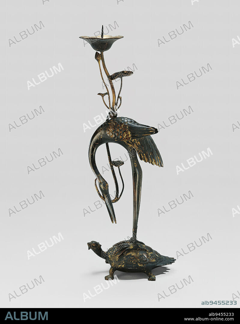 Candlestand of a crane on a long-tailed tortoise, 18th century, Unknown Japanese, 15 15/16 × 5 7/8 × 3 3/8 in. (40.48 × 14.92 × 8.57 cm), Gilt bronze, Japan, 18th century, The crane and the tortoise, which here form the base and body of a candlestick, are both symbols of longevity. The crane is said to live for a thousand years and the tortoise for ten-thousand. Candle stands such as this one served as Buddhist ritual implements.
