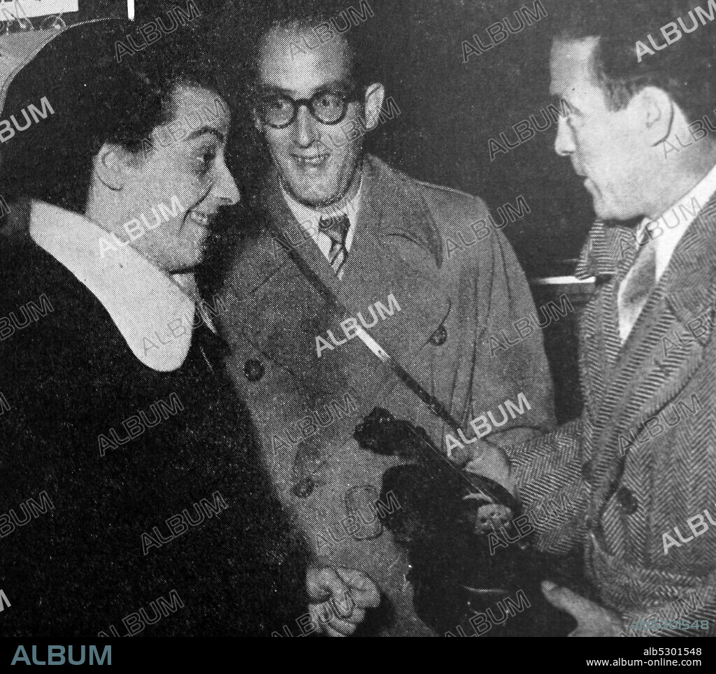 Black and white photograph of 'Images of the World: 1949-1950'; champion boxer Marcel Cerdan (1916-1949) and violinist Ginette Neveu (1919-1949) before the plane crash in the Azores of Air France flight 009 on 28 October 1949 in which both were killed.