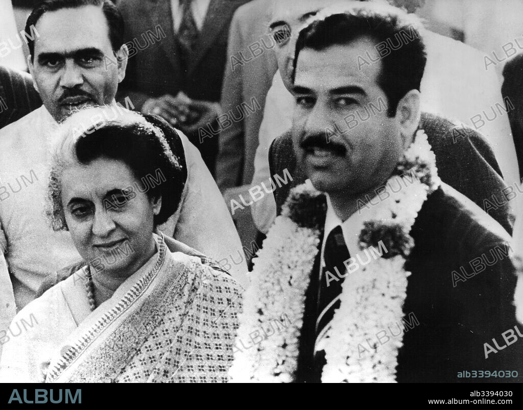 INDIRA GANDHI and SADDAM HUSSEIN. Dec 14, 2003; New Delhi, INDIA; (FILE PHOTO) SADDAM HUSSEIN Captured by US forces today December 14, 2003 in Tikrit, Iraq. Saddam Hussein Captured by US forces today December 14, 2003 in Tikrit, Iraq. Former Iraqi President Saddam Hussein was on the run from coalition forces in Iraq since in the end of the war. April 2nd 1974. Picture shows the then Iraqi Vice-President being greeted by Mrs INDIRA GHANDI on his arrival in New Delhi for talks.. (Credit Image: © Keystone Press Agency/Keystone USA via ZUMAPRESS.com). 14/12/2003