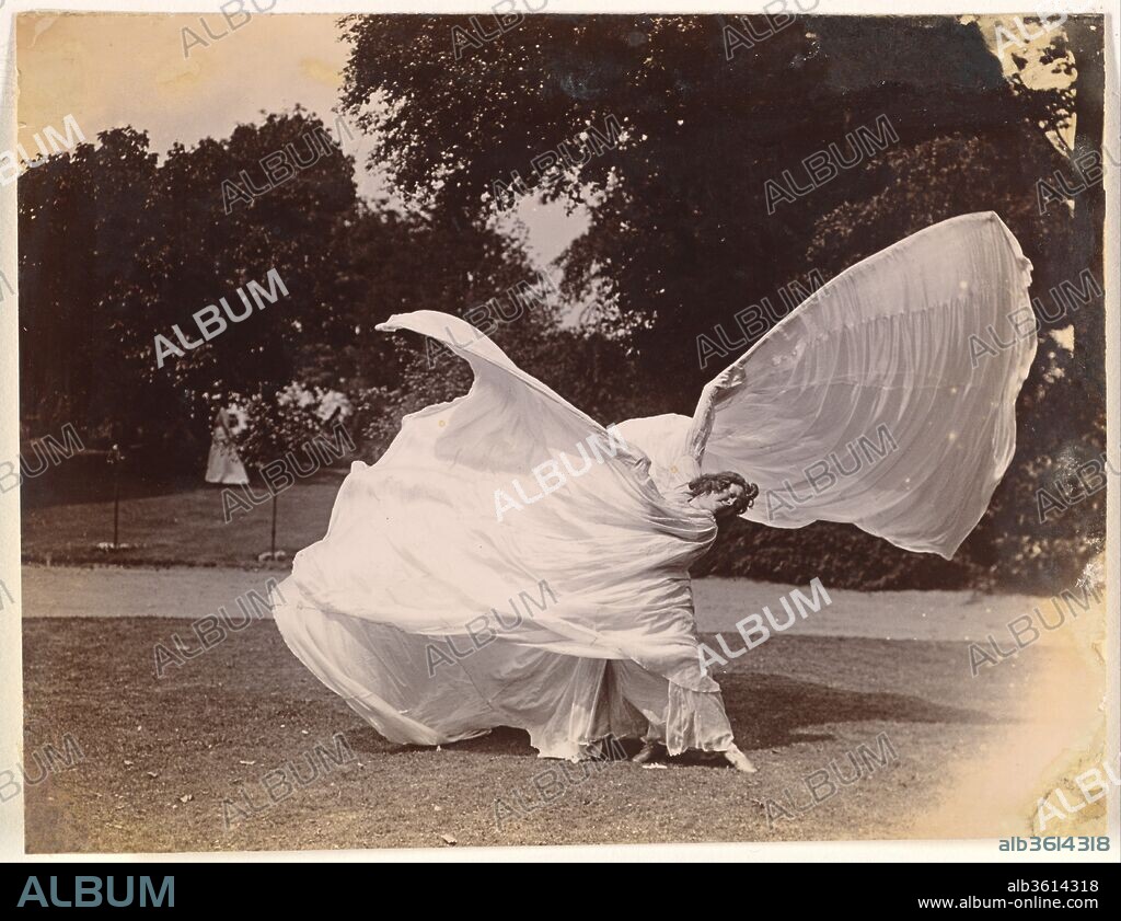 [Loie Fuller Dancing]. Artist: Samuel Joshua Beckett (British, Shadwell, Stepney [London] 1870-1940 Bournemouth). Dimensions: 10.3 x 13.3 cm (4 x 5 1/4 in.), irregularly trimmed. Date: ca. 1900.
The American dancer Loie Fuller (1862-1928) conquered Paris on her opening night at the Folies-Bergère on November 5, 1892. Manipulating with bamboo sticks an immense skirt made of over a hundred yards of translucent, iridescent silk, the dancer evoked organic forms --butterflies, flowers, and flames--in perpetual metamorphosis through a play of colored lights. Loie Fuller's innovative lighting effects, some of which she patented, transformed her dances into enthralling syntheses of movement, color, and music, in which the dancer herself all but vanished. Artists and writers of the 1890s praised her art as an aesthetic breakthrough, and the Symbolist poet Stéphane Mallarmé, who saw her perform in 1893, wrote in his essay on her that her dance was "the theatrical form of poetry par excellence."  Immensely popular, she had her own theater at the 1900 Exposition Universelle in Paris, promoted other women dancers including Isadora Duncan, directed experimental movies, and stopped performing only in 1925.
 Loie Fuller's whirling, undulating silhouette, which embodied the fluid lines of Art Nouveau, inspired many images, from the portraits of Toulouse-Lautrec and the posters of Jules Chéret and Alphonse Mucha to the sculptures of Pierre Roche and Théodore Rivière, as well as the photographs of Harry C. Ellis and Eugène Druet. The three pictures shown here depict movements from such dances as "Dance of the Lily" and "Dance of Flame." These images do not pretend to evoke the otherworldly effect of the performance, which took place on a darkened stage in front of a complex set of mirrors and whose magic was entirely dependent on lighting. Here, the strange shapes, reminiscent of chalices and butterflies, take form, incongruously, in the middle of an urban park, through the efforts of a short, stout figure. Arrested in crude natural light, they still retain, however, their spellbinding energy. Part of a group of thirteen photographs complemented by six others in the Musée d'Orsay, Paris, these images belonged to the sculptor Théodore Rivière (1857-1912), and were previously thought to have been made by him. They have now been reattributed to Samuel Joshua Beckett, a photographer working in London.