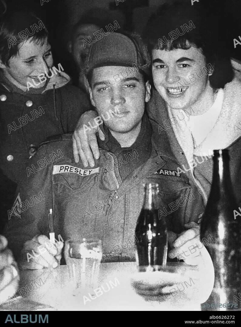 US rock star Elvis Presley is surrounded by fans on the 6th of February in 1960 in a restaurant in Hirschau. Presley had participated in a manoeuvre by the US armed forces and was detected by his fans. 06/02/1960