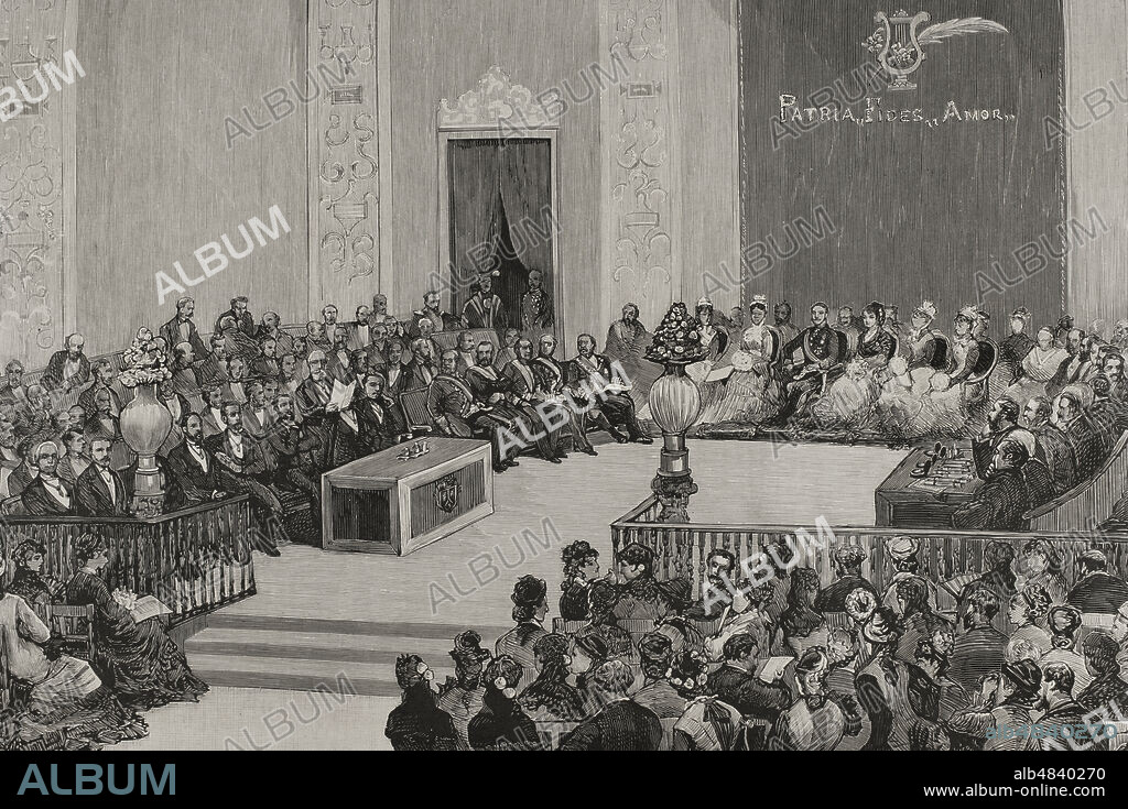 JUAN COMBA GARCÍA (1852-1924). SPANISH ARTIST.. Historia de España. Siglo XIX. Madrid. Distribución de premios en los Juegos Florales, el 28 de abril de 1878, en el paraninfo de la Universidad Central. Presidían el acto los Reyes. El Excmo. Sr. Marqués de Valmar, presidente de los jueces mantenedores, leyendo un discurso alusivo al solemne acto. Dibujo al natural por Comba. Grabado. La Ilustración Española y Americana, 1878.