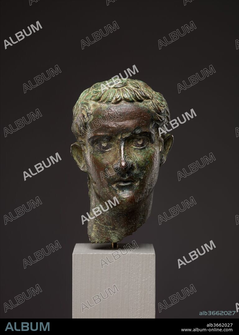 Bronze portrait head of the emperor Gaius (Caligula). Culture: Roman. Dimensions: H. 2 11/16 in. (6.8 cm). Date: ca. A.D. 37-41.
Gaius, more commonly known by his ancient nickname Caligula (Little Boots), was the first emperor to be assassinated. His uncle and successor, Claudius, had his statues and portraits removed from public view. Many were reworked as portraits of Augustus or of Claudius. It also seems that smaller, personal images of Caligula were deliberately thrown away after his murder; several have been recovered from the River Tiber in Rome.