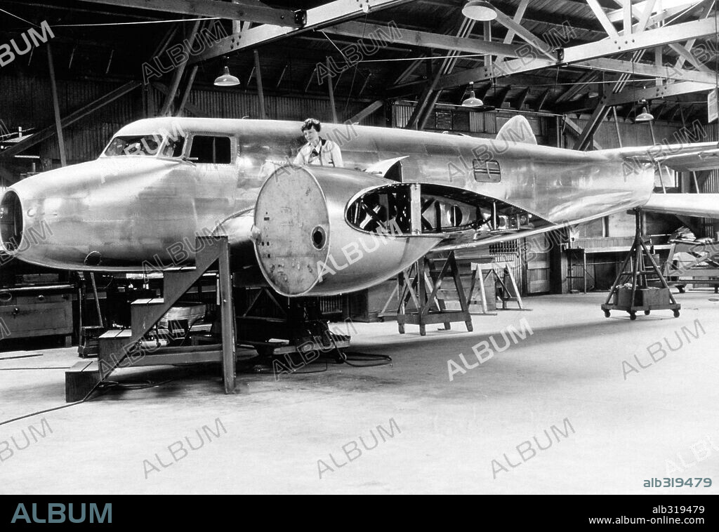 Amelia Earhart, US aviatrix, with her new Lockheed Electra laboratory plane from Purdue University, 1936.