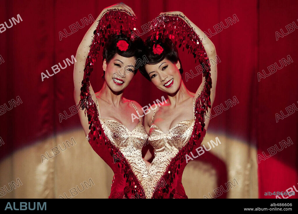 ADA TAI and ARLENE TAI in BIG FISH, 2003, directed by TIM BURTON. Copyright COLUMBIA PICTURES.