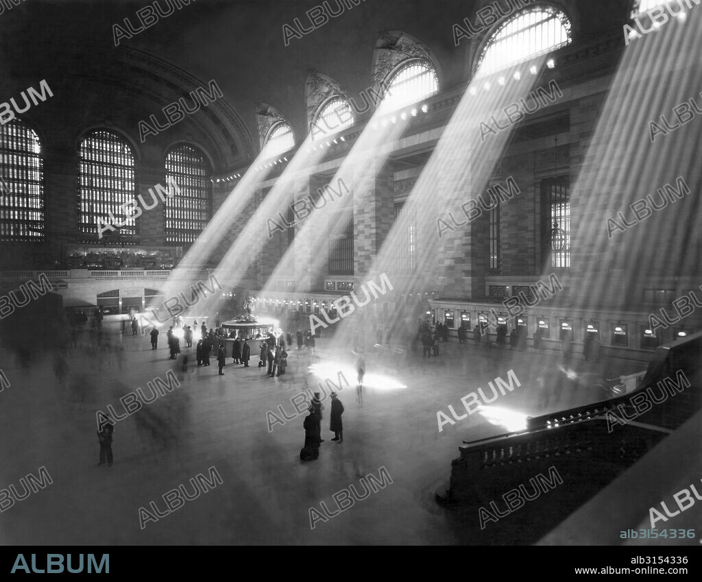 New York, New York:  c. 1940's. An interior shot of the Grand Central Railroad Station, with sunlight streaming in through the clerestory windows above.
