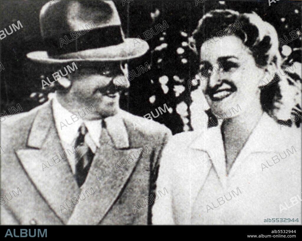 Adolf Hitler with Eva Braun (1912 – 30 April 1945) long-time companion and his later his wife. Braun met Hitler in Munich when she was a 17-year-old assistant and model for his personal photographer Heinrich Hoffmann. 1936.