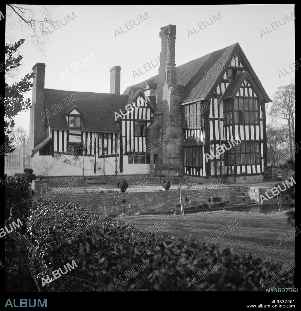 MARJORY L WIGHT. Huddington Court, Huddington, Wychavon, Worcestershire, 1939. An exterior view of Huddington Court. Huddington Court is an early 16th century timber-framed house which was altered circa 1584. It was the home of the Wintour family who were closely associated with the Gunpowder Plot of 1605.
