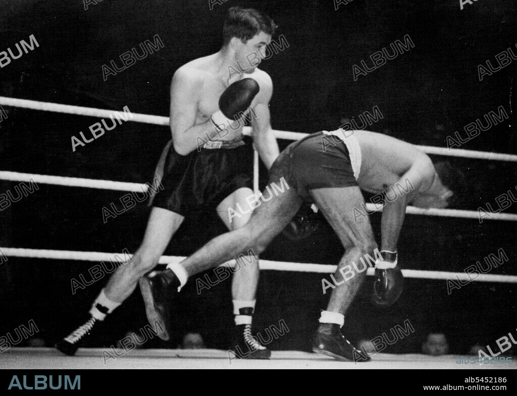 Sands Outclassed By American -- Dave Sands almost pitches through the ropes during the fight.Dave Sands, Half-Aborigine holder of the Australian triple crown in the middle, crusiser and heavyweights, was outclassed and beaten on points by American Tommy Yarsz in their ten-round fight at the Harringay Arana, North London.Before the match, Sands had been heralded as a world-beater. April 05, 1949.