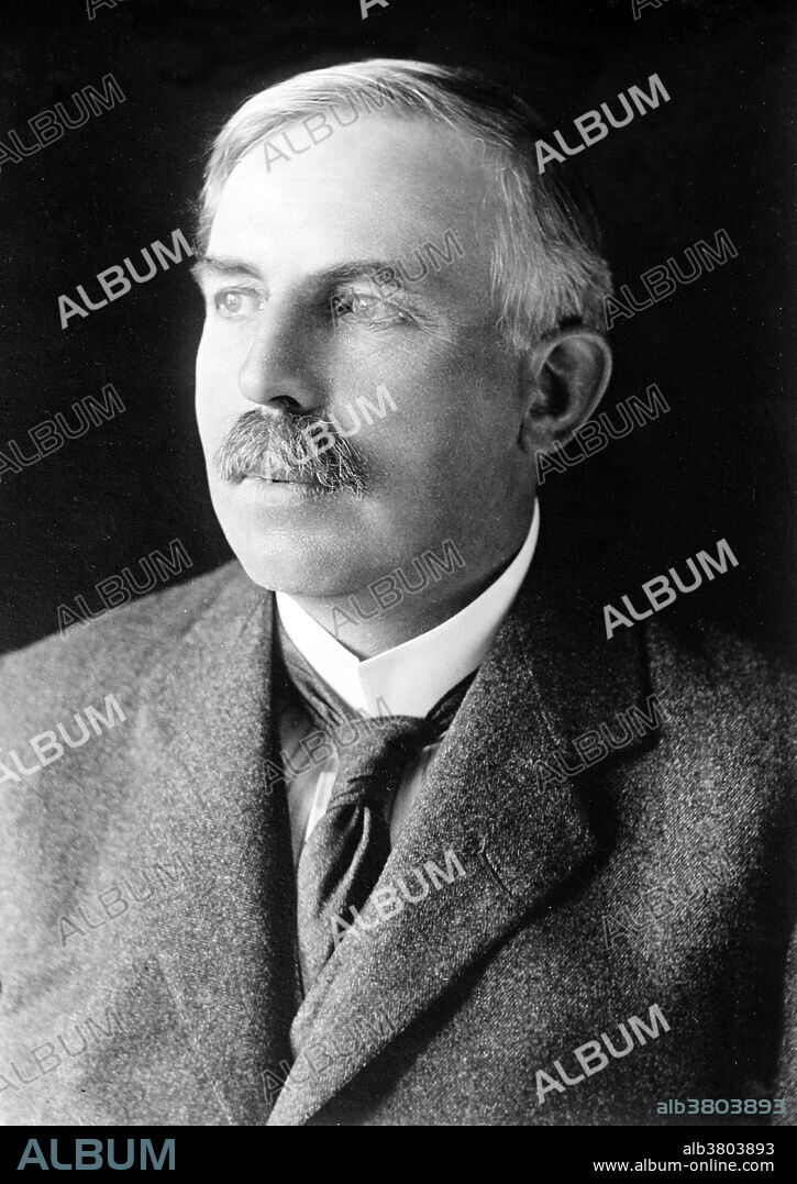Ernest Rutherford (August 30, 1871 - October 19, 1937) was a New Zealand-born British chemist and physicist who became known as the father of nuclear physics. He discovered the concept of radioactive half-life, proved that radioactivity involved the transmutation of one chemical element to another, and also differentiated and named alpha and beta radiation, proving that the former was essentially helium ions. This work was done at McGill University in Canada. It is the basis for the Nobel Prize in Chemistry he was awarded in 1908. In 1911, he theorized that atoms have their positive charge concentrated in a very small nucleus, and thereby pioneered the Rutherford model of the atom, through his discovery and interpretation of Rutherford scattering in his gold foil experiment. He is widely credited with first "splitting the atom" in 1917 in a nuclear reaction between nitrogen and alpha particles, in which he also discovered (and named) the proton. After his death in 1937, he was honored by being interred with the greatest scientists of the United Kingdom, near Sir Isaac Newton's tomb in Westminster Abbey. The chemical element rutherfordium (element 104) was named after him.