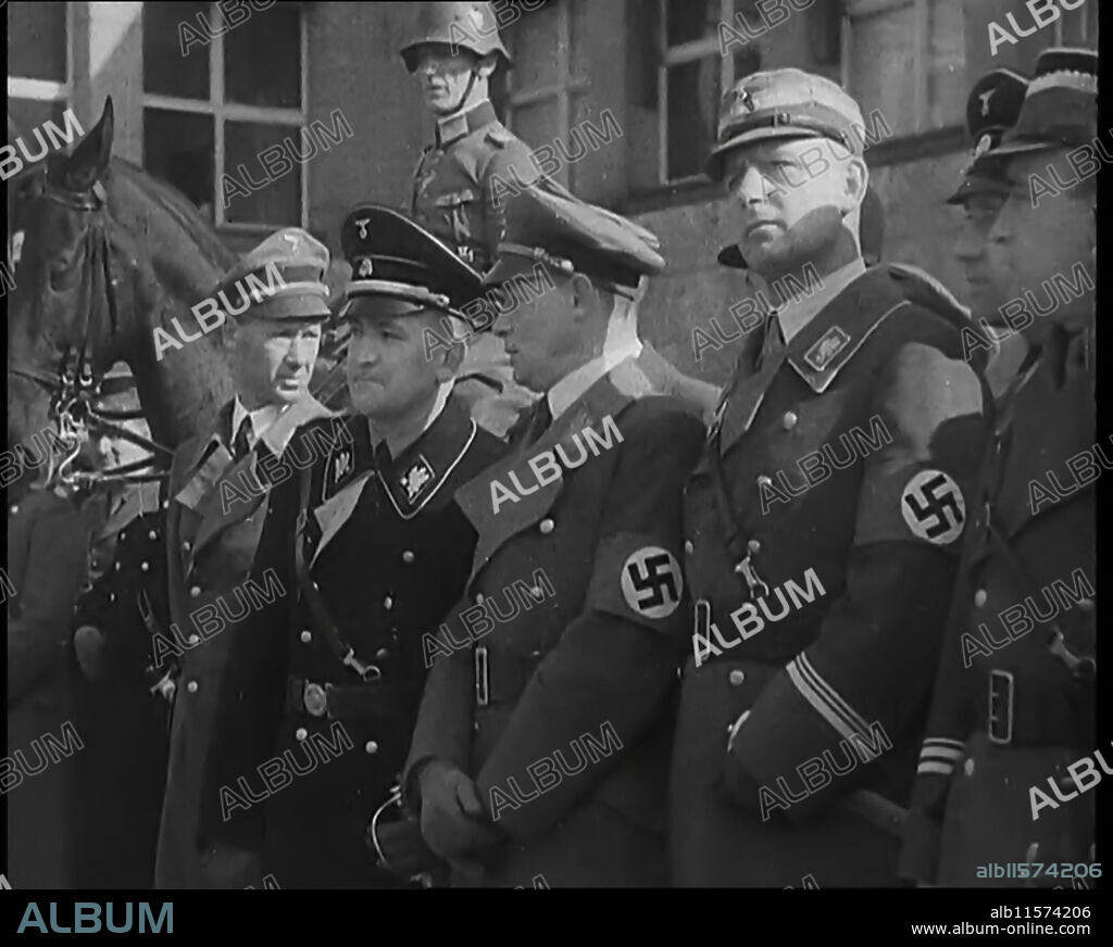 German Officers in the Rhineland, 1936. '...in the...demilitarised Rhineland, the tramp of soldiers' boots across the bridges had demonstrated to the World that Germany's VIP [ie Hitler] had an unusually vigorous mind. Afterwards, they found out that Hitler's troops had orders to withdraw at the first sign of opposition. "So what", some said, "after all the Rhineland is Germany", but it wasn't exactly something to cheer about'. On 7 March 1936, in violation of the Treaty of Versailles, German troops marched into the Rhineland and other regions along the Rhine. German territory west of the Rhine had been off-limits to the German military. From "Time To Remember -  The Time Of The Three Kings", 1936 ( Reel 1); documentary about events of the year of the abdication crisis.
