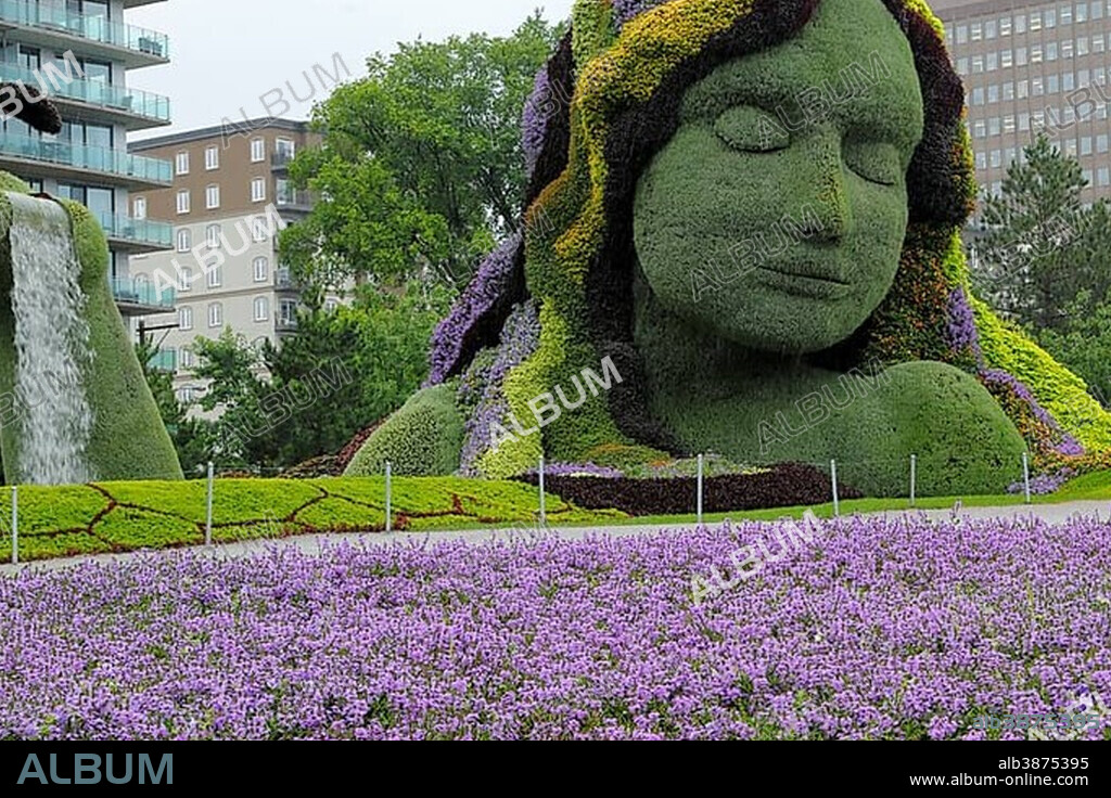 Plant sculpture Mother Earth with modern buildings behind, Mosaicanada Exhibition, Gatineau, Quebec Province, Canada
