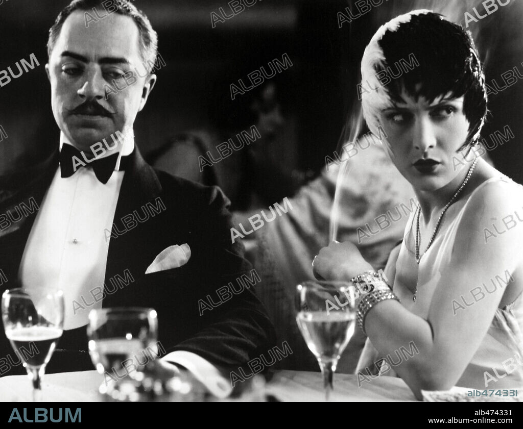EVELYN BRENT and WILLIAM POWELL in THE DRAGNET, 1928, directed by JOSEF VON STERNBERG. Copyright PARAMOUNT PICTURES.