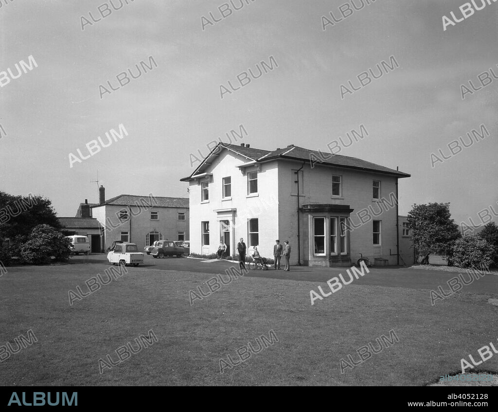 CISWO paraplegic centre, Pontefract, West Yorkshire, 1960. CISWO is the Coal Industry Social Welfare Organisation. Some of the residents of the centre were miners who had met with an accident at work. Some interesting 1950s 3 wheeler cars for the disabled can be seen in the car park.