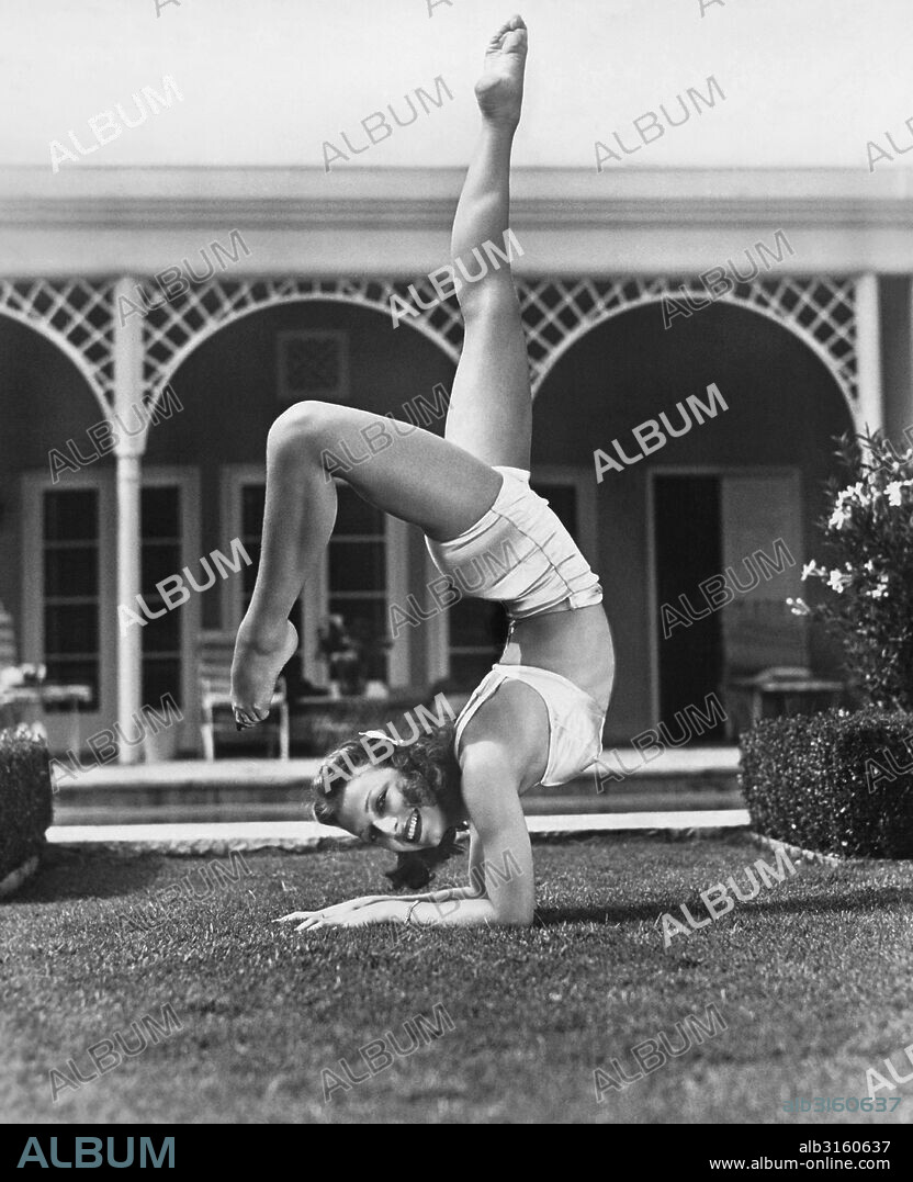 Beverly Hills, California: 1941 Ballerina and actress Vera Zorina does her daily exercises on the lawn of her Berverly Hills home.