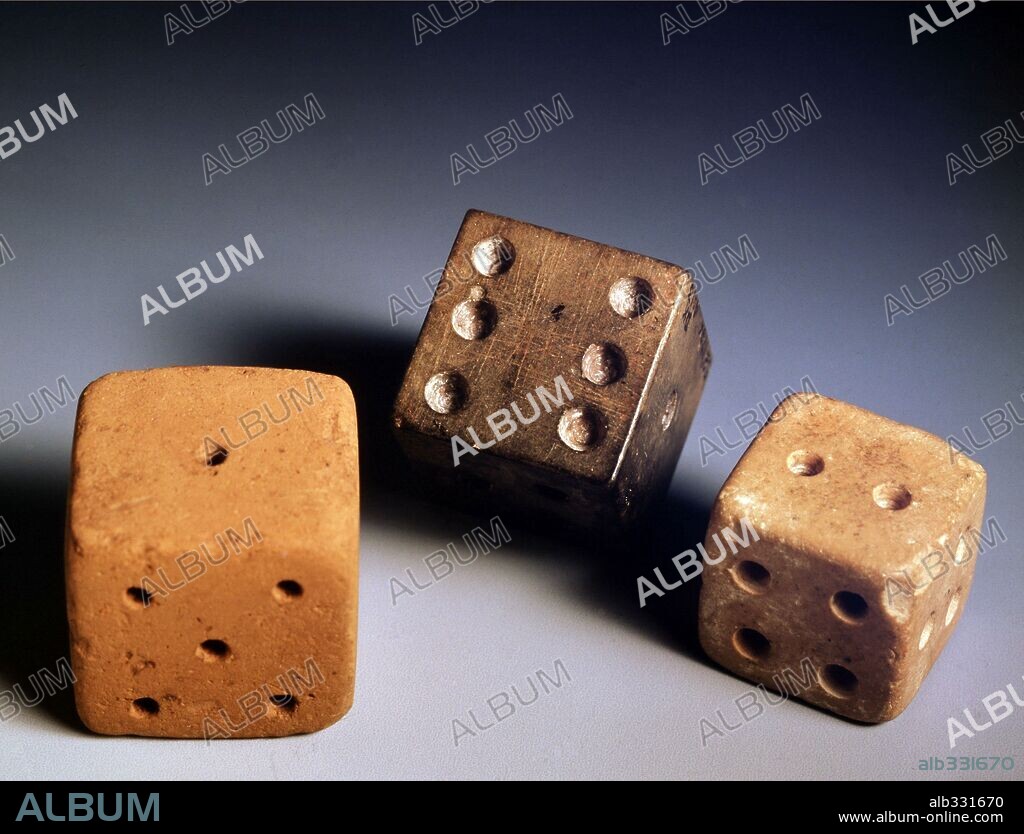 Three gaming pieces in Limestone, from excavations at Mohenjo Daro.