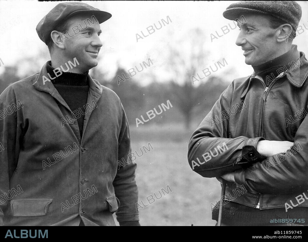Talking Horses. Owner and rider Lord Mildmay (right) is seen chatting with his trainer Mr P Cazalet at the Shipley Kent training stables 1949.