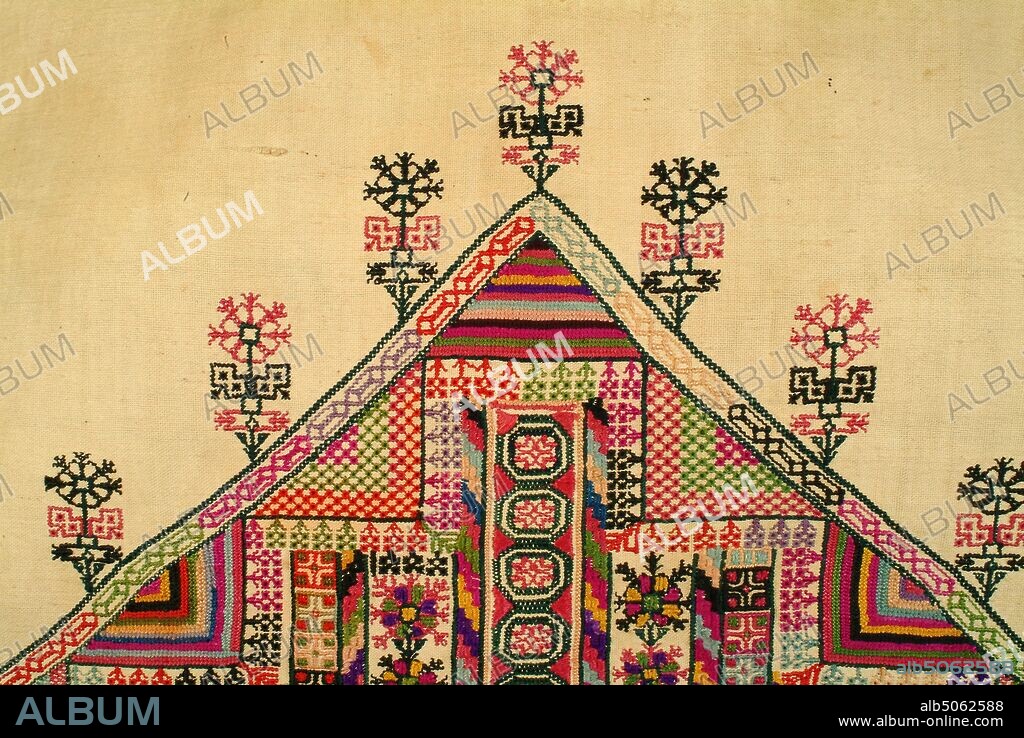 Woman's Dress (Thob), 1800-1900 Palestine, Ramallah Full length woman's dress made of unbleached cotton embroidered in coloured silks. Pointed triangular hanging sleeves. Small round neck slit to about waist level, edged with quilted cotton and outlined in two rows of black backstitch with a white row inbetween. The slit is bound and faced with pink cotton. Two neck ties are of twisted cotton thread with multi-coloured tassels. Seam across the sleeve and the seam to its sloping side have filling of yellow embroidery in yellow with geometric patterns in crimson, pale blue, pink, orange, black, brown, purple. The sleeves have embroidered borders along the edge and along the seam using above colours. The border edging the lower sleeve is different to edging of upper part. All mainly in fine cross-stitch an employ geometric and plant forms. At front of robe is a wide area of elaborate embroidery, straight sided to hip level, the slopes to a point beneath neck slit. Worked in elaborate vertical strip patterns, again using geometric and plant forms in a wide variety of brilliant glowing colours. Main stitches used are fine cross stitch, half cross stitch, satin stitch. Either side of embroidered panel is a seam worked with an insertion in needle lace stitches. Presented, 2003. Wilfred Southall Collection., Applied Arts, Asia, Textiles, Embroidery, Costume, Fashion, Costume, Dress, Needlecraft.