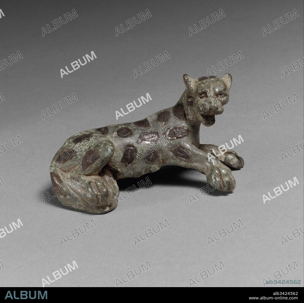 Brooch in the Form of a Panther, 100–300, Roman, Copper alloy inlaid with silver and niello, Overall: 1 5/16 x 2 1/2 x 1 1/8 in. (3.4 x 6.3 x 2.9 cm), Metalwork-Copper alloy, This brooch is exceptional in its naturalistic rendering of a panther. The spots were created not with enamels but by the niello process, in which incisions in the silver were filled with an alloy of black sulphur that was then heated.