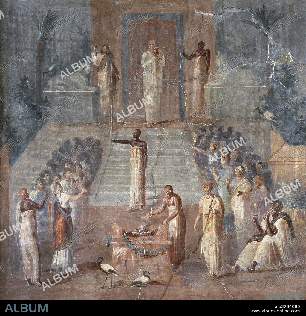 Fresco romano. Ceremonia de culto en el templo de Isis. Se pueden ver palmeras, esfinges e ibis, elementos de origen egipcio como la diosa. Los fieles divididos en dos filas, un sacerdote en un altar realizando un sacrificio, un hombre sentado tocando la flauta. Procedente de Herculano, 50-79 d. C, cerca del teatro. Museo Arqueológico Nacional. Nápoles. Italia.
